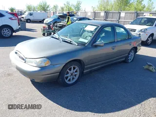 1999 Ford Contour SE Fleet z VIN 1FAFP66L7XK115659, wystawiony jako IAAI lot #42142065 z przebiegiem 161 018 mil mil oraz . Historia ofert i sprzedaży dostępna na DreamBid. Obrazek 2.
