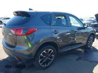 2016 Mazda CX-5 Grand Touring z VIN JM3KE2DYXG0649781, wystawiony jako IAAI lot #41636329 z przebiegiem 83 433 mil mil oraz . Historia ofert i sprzedaży dostępna na DreamBid. Obrazek 4.