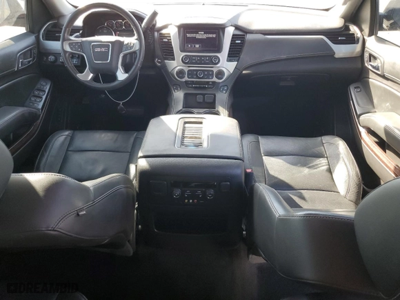 2016 GMC Yukon SLT with VIN 1GKS2BKC2GR251876, listed as a Copart auction lot 77204944 with 111,099 mi miles and Salvage Title. Bid and sale history available at carsss.com. Image 8.
