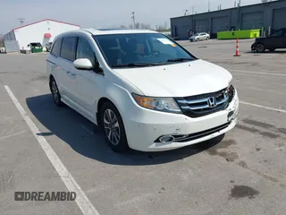 2016 Honda Odyssey Touring Elite with VIN 5FNRL5H97GB044278, listed as a IAAI auction lot 42056101 with 182,396 mi miles and . Bid and sale history available at DreamBid. Image 1.