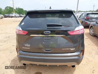 2020 Ford Edge Titanium z VIN 2FMPK4K98LBA76737, wystawiony jako IAAI lot #41981689 z przebiegiem 93 501 mil mil oraz . Historia ofert i sprzedaży dostępna na DreamBid. Obrazek 16.