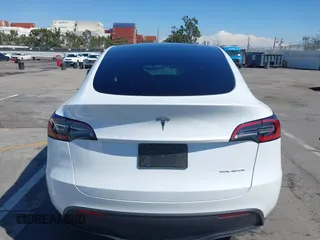 2023 Tesla Model Y Long Range with VIN 7SAYGDEEXPA129790, listed as a IAAI auction lot 41735721 with 20,402 mi miles and . Bid and sale history available at DreamBid. Image 17.