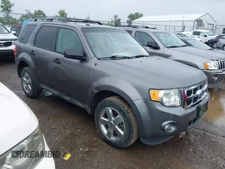 2012 Ford Escape XLT z VIN 1FMCU9DG8CKB40752, wystawiony jako IAAI lot #42644230 z przebiegiem 198 696 mil mil oraz . Historia ofert i sprzedaży dostępna na DreamBid. Obrazek 1.