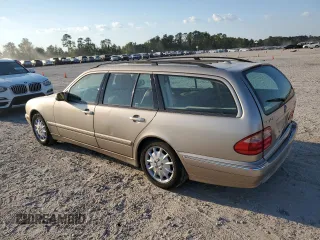 2000 Mercedes-Benz E-Class with VIN WDBJH65J4YB071699, listed as a Copart auction lot 75082144 with 105,989 mi miles and Salvage Title. Bid and sale history available at carsss.com. Image 2.
