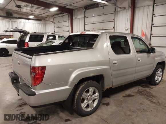 2009 Honda Ridgeline RTL with VIN 2HJYK16519H000129, listed as a IAAI auction lot 41891810 with 186,124 mi miles. Bid and sale history available at carsss.com. Image 4.