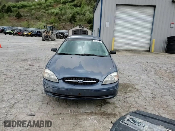 2000 Ford Taurus SE z VIN 1FAFP53U5YA259273, wystawiony jako Copart lot #52787305 z przebiegiem 234 848 mil mil oraz Szkoda całkowita • Salvage title. Historia ofert i sprzedaży dostępna na DreamBid. Obrazek 11.