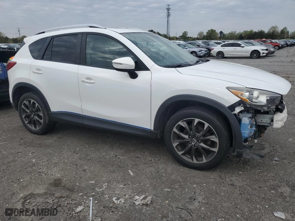 2016 Mazda CX-5 Grand Touring with VIN JM3KE4DY9G0689491, listed as a Copart auction lot 52718395 with 123,090 mi miles and Salvage Title. Bid and sale history available at carsss.com. Image 4.
