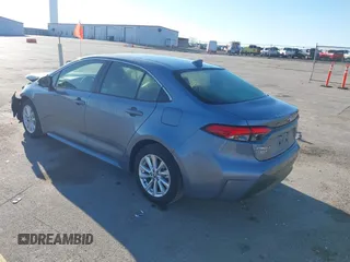2023 Toyota Corolla Hybrid LE with VIN JTDBCMFEXPJ014034, listed as a IAAI auction lot 41865829 with 33,210 mi miles and . Bid and sale history available at carsss.com. Image 3.