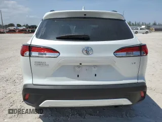 2024 Toyota Corolla Cross LE with VIN 7MUCAAAG7RV090677, listed as a Copart auction lot 57615565 with 6,910 mi miles and Salvage title. Bid and sale history available at DreamBid. Image 6.