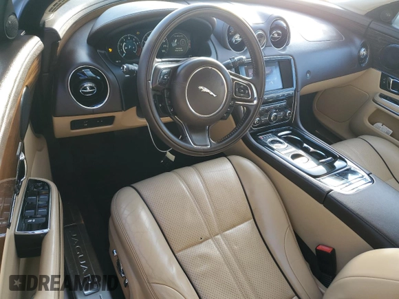 2016 Jaguar XJ with VIN SAJWA1CE4GMV91734, listed as a Copart auction lot 81005144 with 31,924 mi miles and Salvage Title. Bid and sale history available at DreamBid. Image 8.