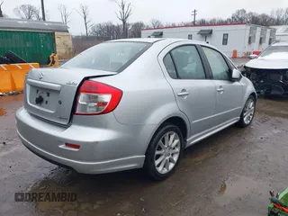 2011 Suzuki SX4 with VIN JS2YC5A41B6300385, listed as a IAAI auction lot 41570810 with 117,847 mi miles and . Bid and sale history available at DreamBid. Image 4.