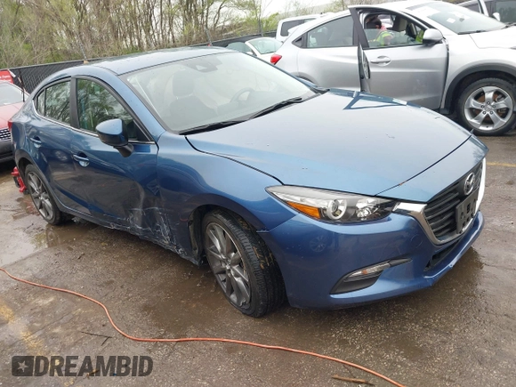 2018 Mazda 3 Touring with VIN 3MZBN1V35JM217641, listed as a IAAI auction lot 41943433 with 64,884 mi miles. Bid and sale history available at carsss.com. Image 1.