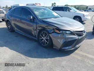 2023 Toyota Camry SE with VIN 4T1G11AK1PU809099, listed as a IAAI auction lot 41450292 with 128,099 mi miles. Bid and sale history available at carsss.com. Image 6.