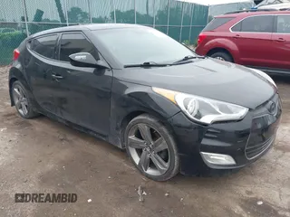 2013 Hyundai Veloster w/Black Int with VIN KMHTC6AD7DU170049, listed as a IAAI auction lot 42441737 with 101,924 mi miles and . Bid and sale history available at DreamBid. Image 1.