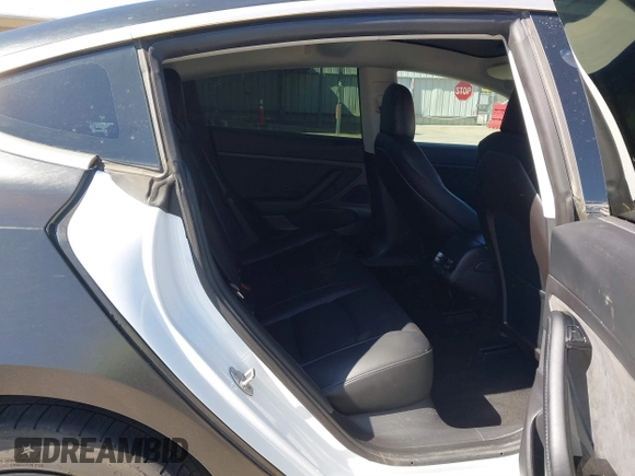 2020 Tesla Model 3 Standard Range Plus with VIN 5YJ3E1EA0LF597761, listed as a IAAI auction lot 41773918 with 89,957 mi miles. Bid and sale history available at carsss.com. Image 8.