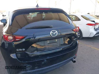 2020 Mazda CX-5 Grand Touring z VIN JM3KFADMXL0740144, wystawiony jako IAAI lot #41830203 z przebiegiem 70 535 mil mil oraz . Historia ofert i sprzedaży dostępna na DreamBid. Obrazek 16.