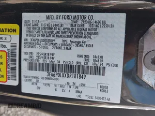 2013 Ford Fusion SE Hybrid z VIN 3FA6P0LUXDR181849, wystawiony jako IAAI lot #41949276 z przebiegiem 112 688 mil mil oraz . Historia ofert i sprzedaży dostępna na DreamBid. Obrazek 9.