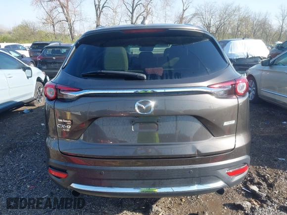 2016 Mazda CX-9 Grand Touring z VIN JM3TCBDY3G0104001, wystawiony jako IAAI lot #41961054 z przebiegiem 77 057 mil mil oraz . Historia ofert i sprzedaży dostępna na DreamBid. Obrazek 16.