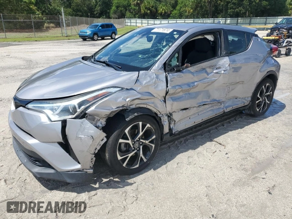 2018 Toyota C-HR XLE with VIN NMTKHMBX7JR021704, listed as a Copart auction lot 71171874 with 82,872 mi miles and Salvage Title. Bid and sale history available at DreamBid. Image 1.