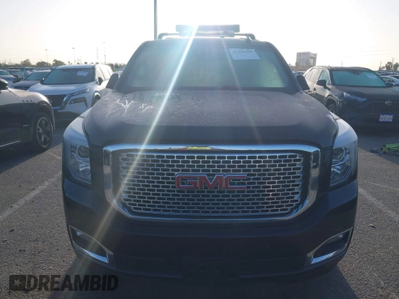 2015 GMC Yukon Denali z VIN 1GKS1CKJ7FR566419, wystawiony jako IAAI lot #41948825 z przebiegiem 235 037 mil mil oraz . Historia ofert i sprzedaży dostępna na DreamBid. Obrazek 12.