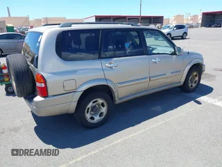 2002 Suzuki XL-7 with VIN JS3TY92V724105263, listed as a IAAI auction lot 41858262 with 103,249 mi miles. Bid and sale history available at carsss.com. Image 4.