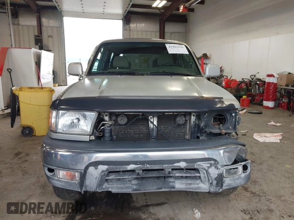 1999 Toyota 4Runner SR5 z VIN JT3HN86R8X0221532, wystawiony jako IAAI lot #41902556 z przebiegiem 406 602 mil mil oraz . Historia ofert i sprzedaży dostępna na DreamBid. Obrazek 13.