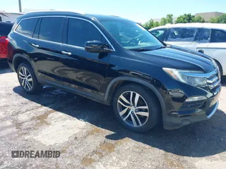 2017 Honda Pilot Elite with VIN 5FNYF6H07HB047306, listed as a IAAI auction lot 42430320 with 124,891 mi miles and . Bid and sale history available at DreamBid. Image 1.