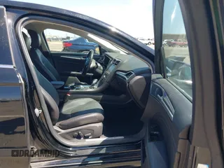 2016 Ford Fusion Titanium Hybrid z VIN 3FA6P0RUXGR123445, wystawiony jako IAAI lot #42606596 z przebiegiem 145 541 mil mil oraz . Historia ofert i sprzedaży dostępna na DreamBid. Obrazek 5.