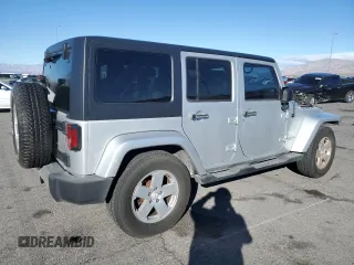 2007 Jeep Wrangler Unlimited Sahara with VIN 1J4GB59197L144781, listed as a Copart auction lot 48678315 with 137,538 mi miles and Salvage title. Bid and sale history available at DreamBid. Image 3.
