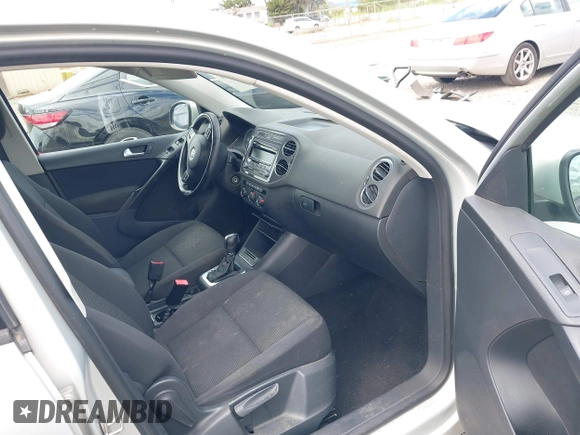 2013 Volkswagen Tiguan SEL with VIN WVGBV3AX1DW571843, listed as a IAAI auction lot 42540191 with 140,639 mi miles and . Bid and sale history available at DreamBid. Image 5.