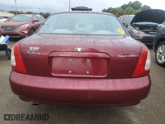 1999 Daewoo Nubira CDX z VIN KLAJB52Z5XK256700, wystawiony jako Copart lot #75085934 z przebiegiem Nie podano mil oraz Szkody całkowita. Historia ofert i sprzedaży dostępna na DreamBid. Obrazek 6.