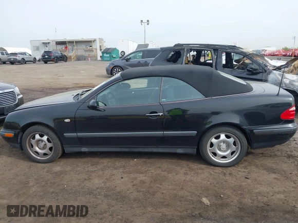 1999 Mercedes-Benz CLK with VIN WDBLK65G1XT013704, listed as a IAAI auction lot 42115880 with 85,741 mi miles. Bid and sale history available at carsss.com. Image 14.