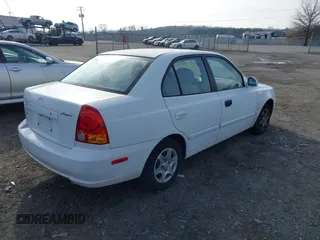 2004 Hyundai Accent GL with VIN KMHCG45C64U539526, listed as a IAAI auction lot 41199434 with 81,442 mi miles. Bid and sale history available at carsss.com. Image 4.