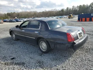 1999 Lincoln Town Car Executive z VIN 1LNHM81W4XY714116, wystawiony jako Copart lot #44424595 z przebiegiem 210 041 mil mil oraz Szkoda całkowita • Salvage title. Historia ofert i sprzedaży dostępna na DreamBid. Obrazek 2.