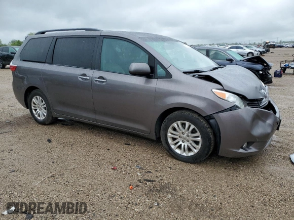 2015 Toyota Sienna XLE with VIN 5TDYK3DC0FS686792, listed as a Copart auction lot 57472045 with 222,663 mi miles and Salvage title. Bid and sale history available at DreamBid. Image 4.