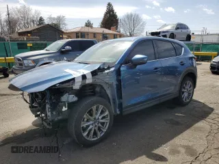 2021 Mazda CX-5 Grand Touring Reserve with VIN JM3KFBAY8M0384498, listed as a Copart auction lot 52013445 with 20,469 mi miles and Salvage Title. Bid and sale history available at carsss.com. Image 1.