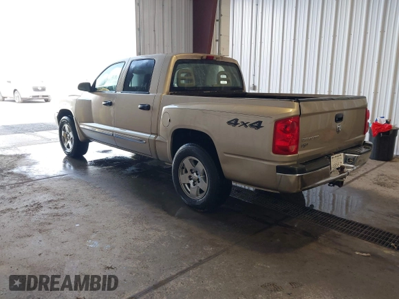 2005 Dodge Dakota Laramie with VIN 1D7HW58N15S159061, listed as a IAAI auction lot 41898306 with 114,288 mi miles and . Bid and sale history available at DreamBid. Image 3.