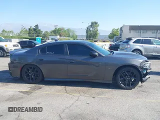 2019 Dodge Charger R/T z VIN 2C3CDXCT7KH527732, wystawiony jako IAAI lot #42283453 z przebiegiem 99 755 mil mil oraz . Historia ofert i sprzedaży dostępna na DreamBid. Obrazek 14.