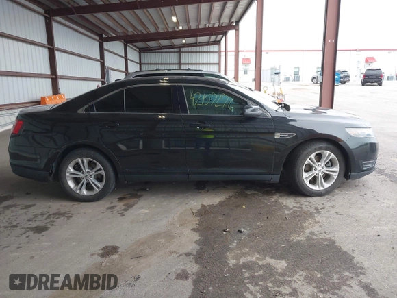 2015 Ford Taurus SEL z VIN 1FAHP2E86FG165100, wystawiony jako IAAI lot #42157272 z przebiegiem 141 846 mil mil oraz . Historia ofert i sprzedaży dostępna na DreamBid. Obrazek 13.