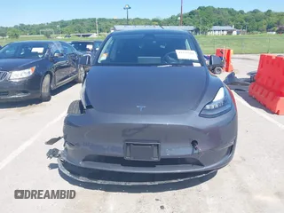 2023 Tesla Model Y Long Range with VIN 7SAYGDEE4PA037218, listed as a IAAI auction lot 42232704 with 18,756 mi miles and . Bid and sale history available at DreamBid. Image 13.