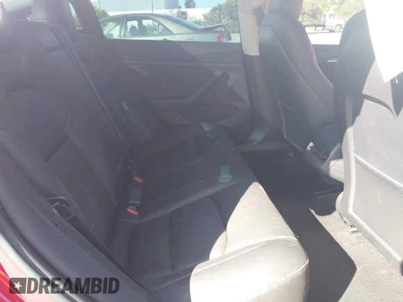 2023 Tesla Model 3 with VIN 5YJ3E1EA1PF385490, listed as a IAAI auction lot 42315884 with 17,590 mi miles and . Bid and sale history available at DreamBid. Image 8.