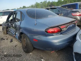 1999 Ford Taurus LX z VIN 1FAFP52UXXA159704, wystawiony jako Copart lot #52350774 z przebiegiem 112 562 mil mil oraz Szkody całkowita. Historia ofert i sprzedaży dostępna na DreamBid. Obrazek 2.