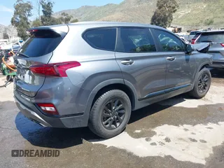 2019 Hyundai Santa Fe SE with VIN 5NMS23AD7KH009688, listed as a IAAI auction lot 41991686 with 77,942 mi miles and . Bid and sale history available at DreamBid. Image 4.