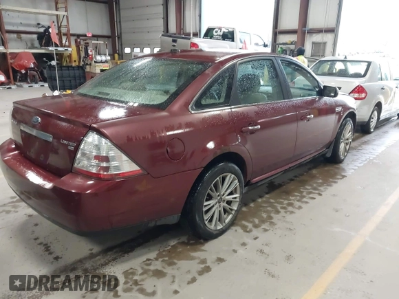 2008 Ford Taurus Limited with VIN 1FAHP28W28G153930, listed as a IAAI auction lot 42154827 with 243,386 mi miles. Bid and sale history available at carsss.com. Image 4.
