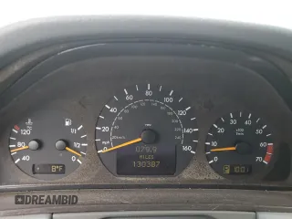 2000 Mercedes-Benz E 320 with VIN WDBJF65J1YB099417, listed as a Copart auction lot 54656915 with 130,387 mi miles and Salvage Title. Bid and sale history available at DreamBid. Image 9.