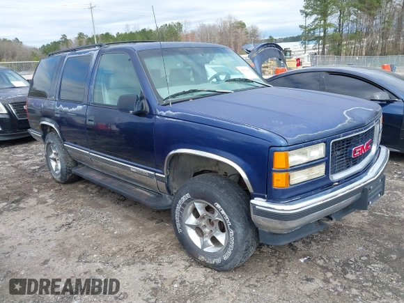 1997 GMC Yukon with VIN 1GKEK13R6VJ715421, listed as a IAAI auction lot 41811398 with 214,735 mi miles. Bid and sale history available at carsss.com. Image 1.