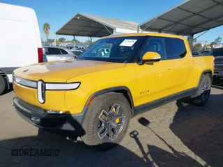 2022 Rivian R1T Adventure Package with VIN 7FCTGAAA2NN005811, listed as a IAAI auction lot 41706558 with 21,336 mi miles. Bid and sale history available at carsss.com. Image 2.