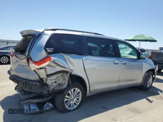 2014 Toyota Sienna XLE with VIN 5TDYK3DCXES496657, listed as a Copart auction lot 60498015 with 178,486 mi miles and Salvage title. Bid and sale history available at DreamBid. Image 3.