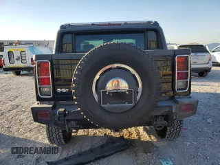 2005 Hummer H2 SUT with VIN 5GRGN22U85H109003, listed as a Copart auction lot 76557734 with 115,249 mi miles and Salvage Title. Bid and sale history available at carsss.com. Image 6.