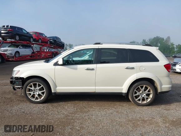 2013 Dodge Journey Crew with VIN 3C4PDCDG0DT591533, listed as a IAAI auction lot 42630548 with 164,961 mi miles and . Bid and sale history available at DreamBid. Image 14.